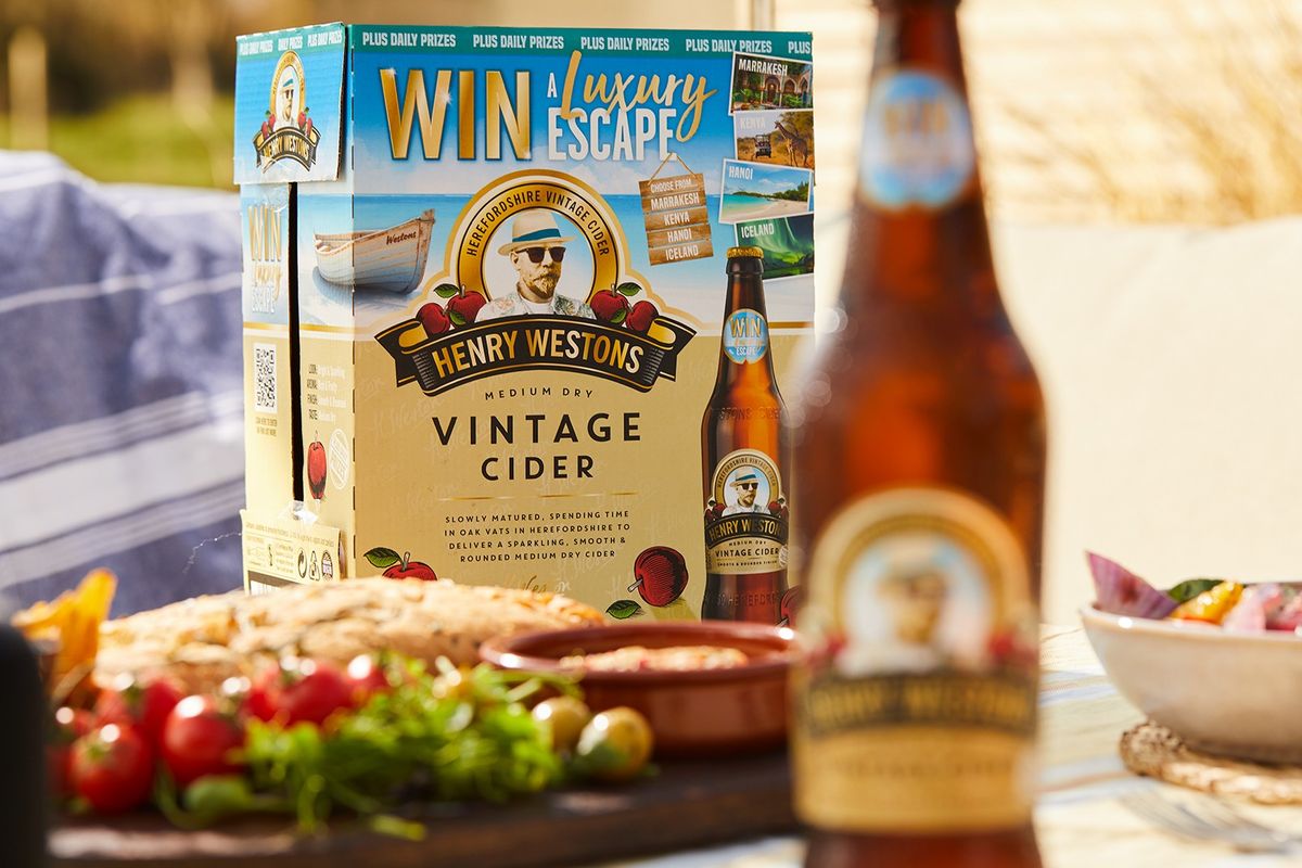 Henry Westons cider bottles with luxury holiday competition labels displayed