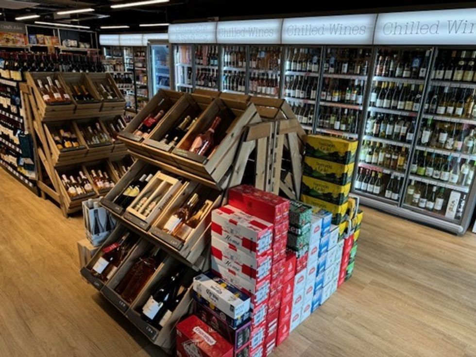 Interior of Wine Rack store in Bicester, showcasing hybrid wine bar and retail layout
