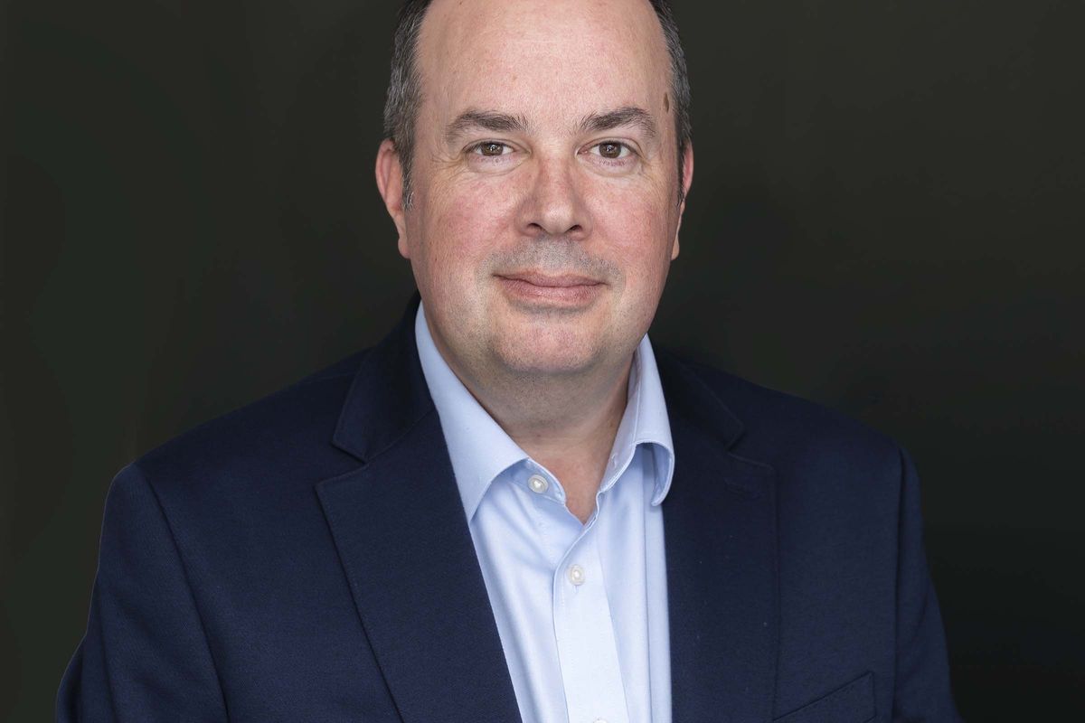 Jonathan Duffin, new CEO of Purity Soft Drinks, stands with Juice Burst and Firefly bottles, signaling leadership change in 2025.