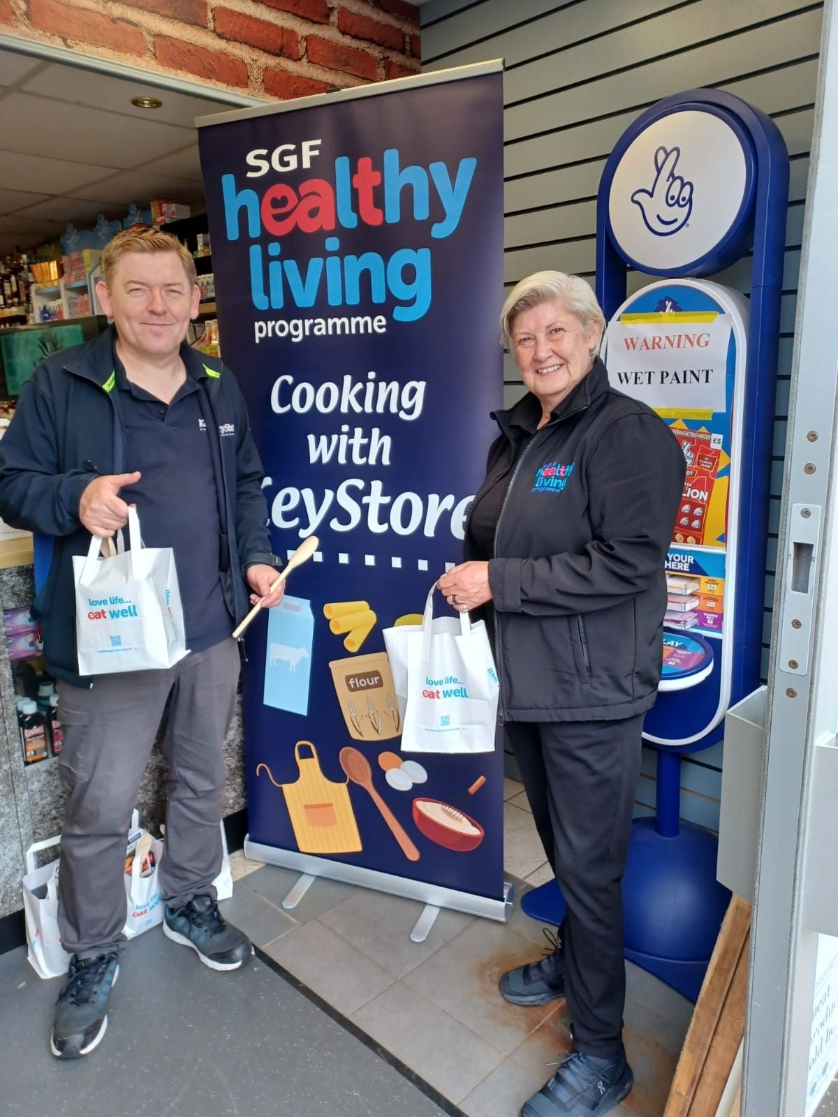 KeyStore staff with free meal kits for SGF Healthy Living campaign