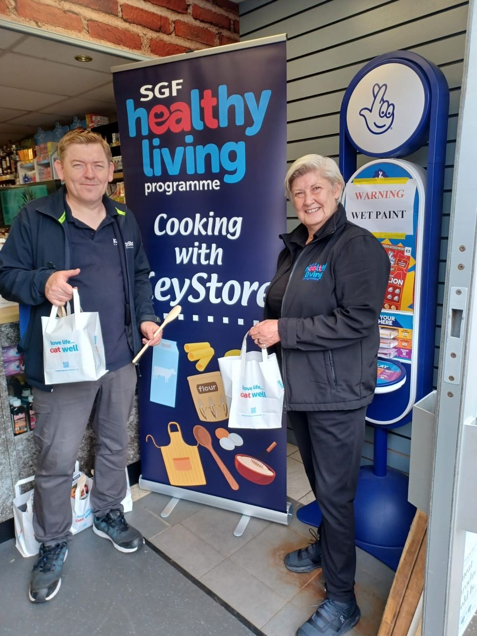 KeyStore staff with free meal kits for SGF Healthy Living campaign