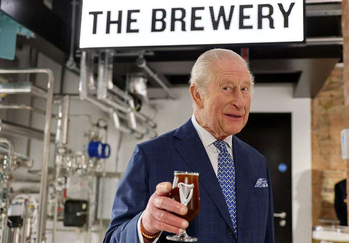 King Charles III tastes a Guinness during his visit to officially open the Guinness Open Gate Brewery London 