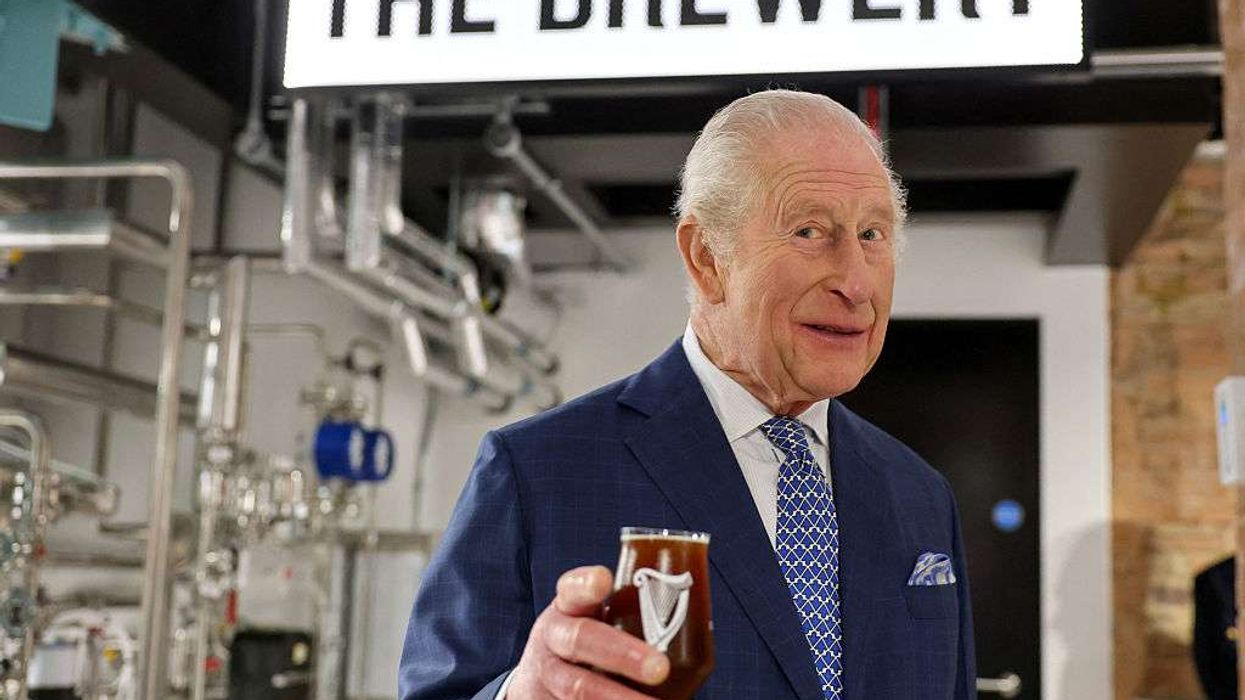King Charles III tastes a Guinness during his visit to officially open the Guinness Open Gate Brewery London