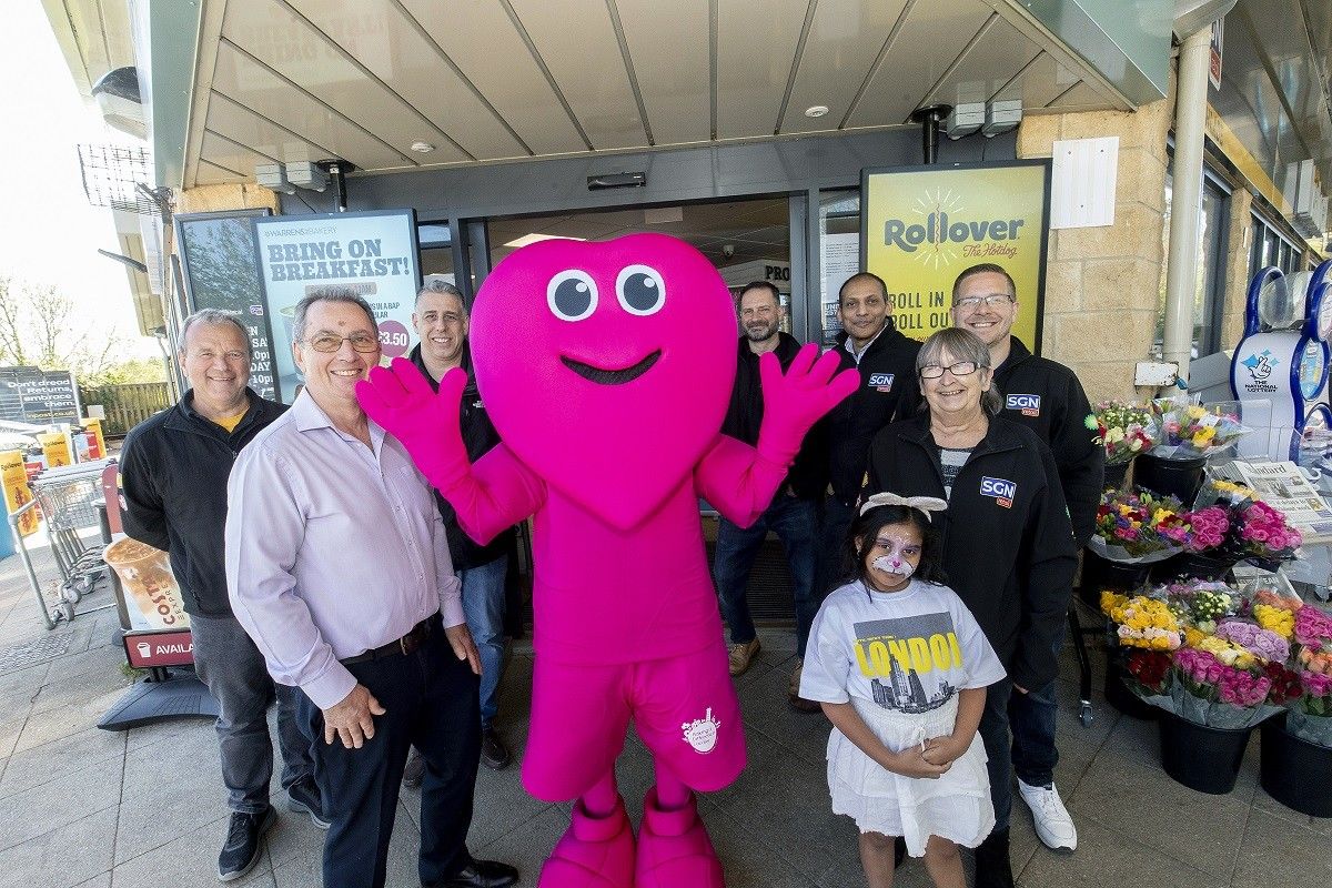 Lechlade community enjoying an Easter celebration at Nisa Local Lechlade Service Station, featuring free hotdogs, prizes, and fundraising activities.