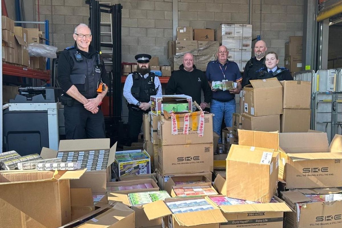 Liverpool City Council and Merseyside Police officers display 7,700 seized illicit vapes and 23,400 cigarettes, worth £105,000, from a wholesaler in Old Swan in 2025, highlighting efforts to combat unregulated goods.