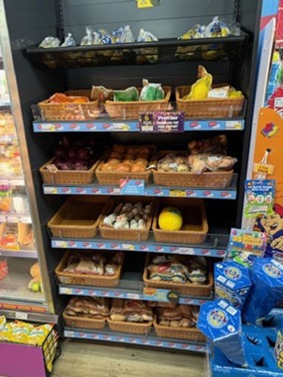Local eggs, potatoes, and cakes on shelves at Premier Rassau Stores, supporting Ebbw Vale community