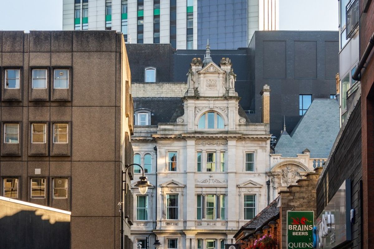 Local shoppers and outdoor seating on a revitalized high street in a low traffic neighbourhood