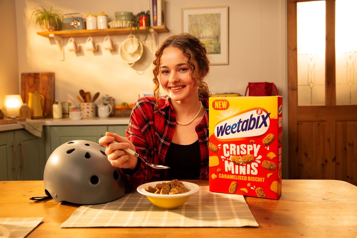 Lola Tambling skateboarding through a giant cereal bowl of Weetabix Crispy Minis Caramelised Biscuit