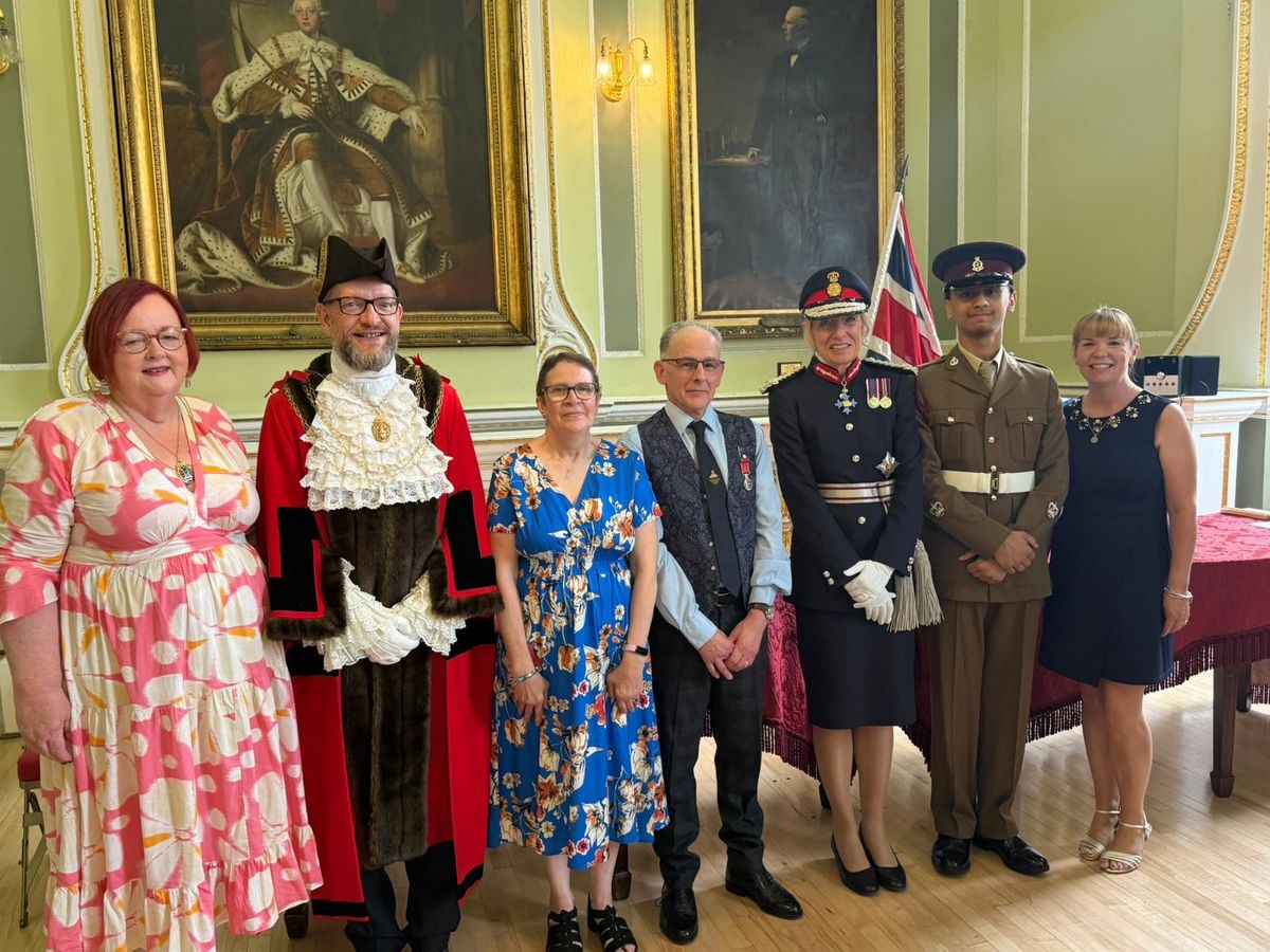 Lord-Lieutenant of South Yorkshire Dame Hilary Chapman, Richard Haley and his wife Steph, with Post Office Area Manager Joanne Fryatt.