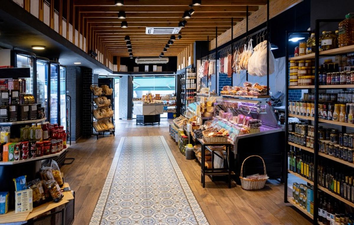 Modern convenience store with food-to-go, tech checkouts, and sustainable displays