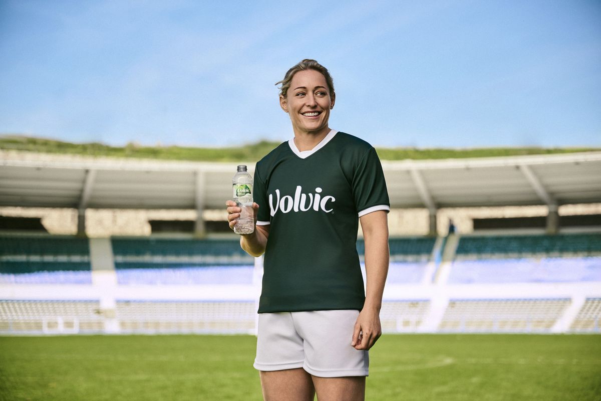Natasha Hunt, Volvic ambassador, holds a bottle at Women’s Rugby World Cup 2025 event