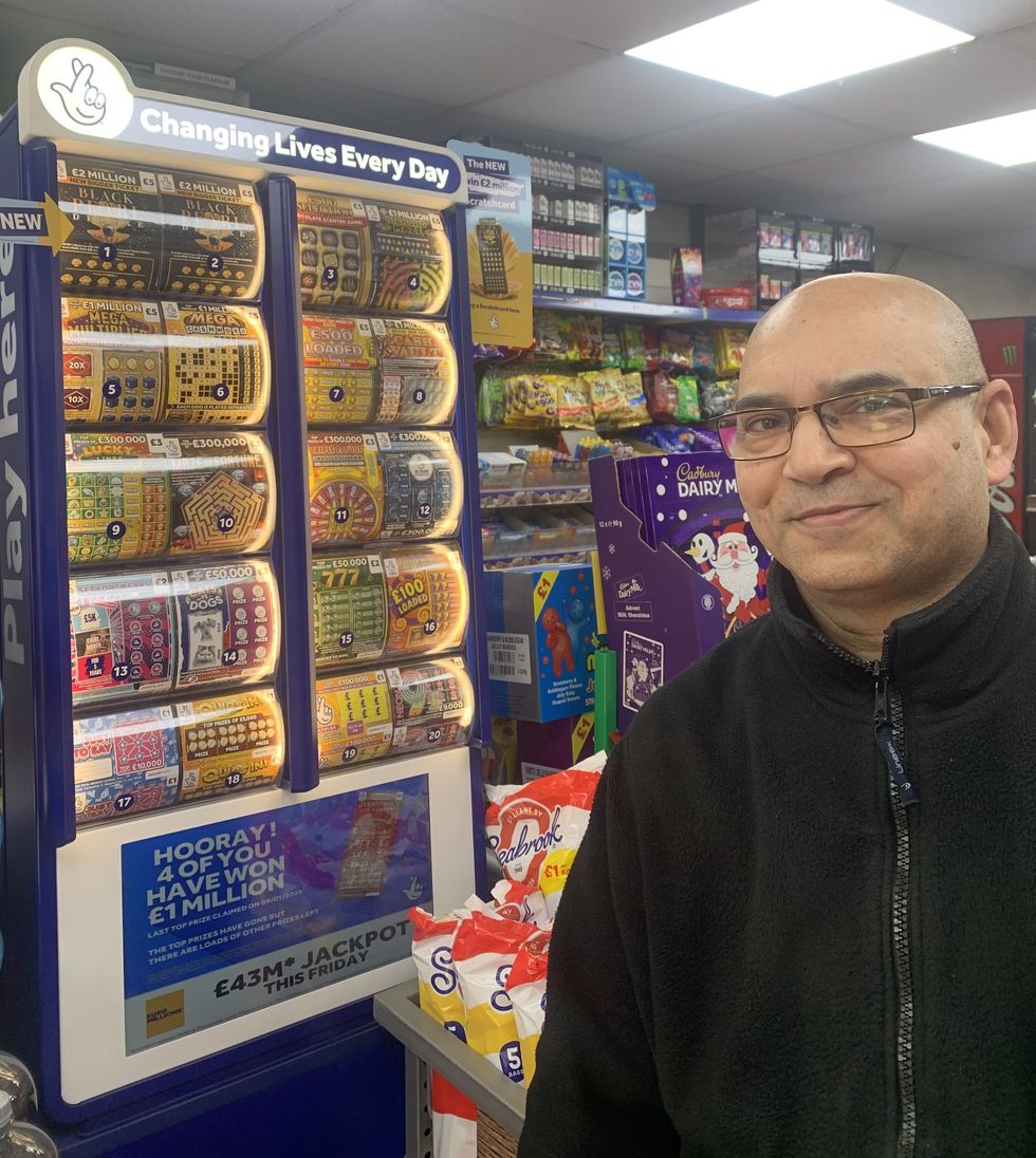 National Lottery retailer Tanwir Hussain with new POS display, celebrating \u00a31,000 win in 2025