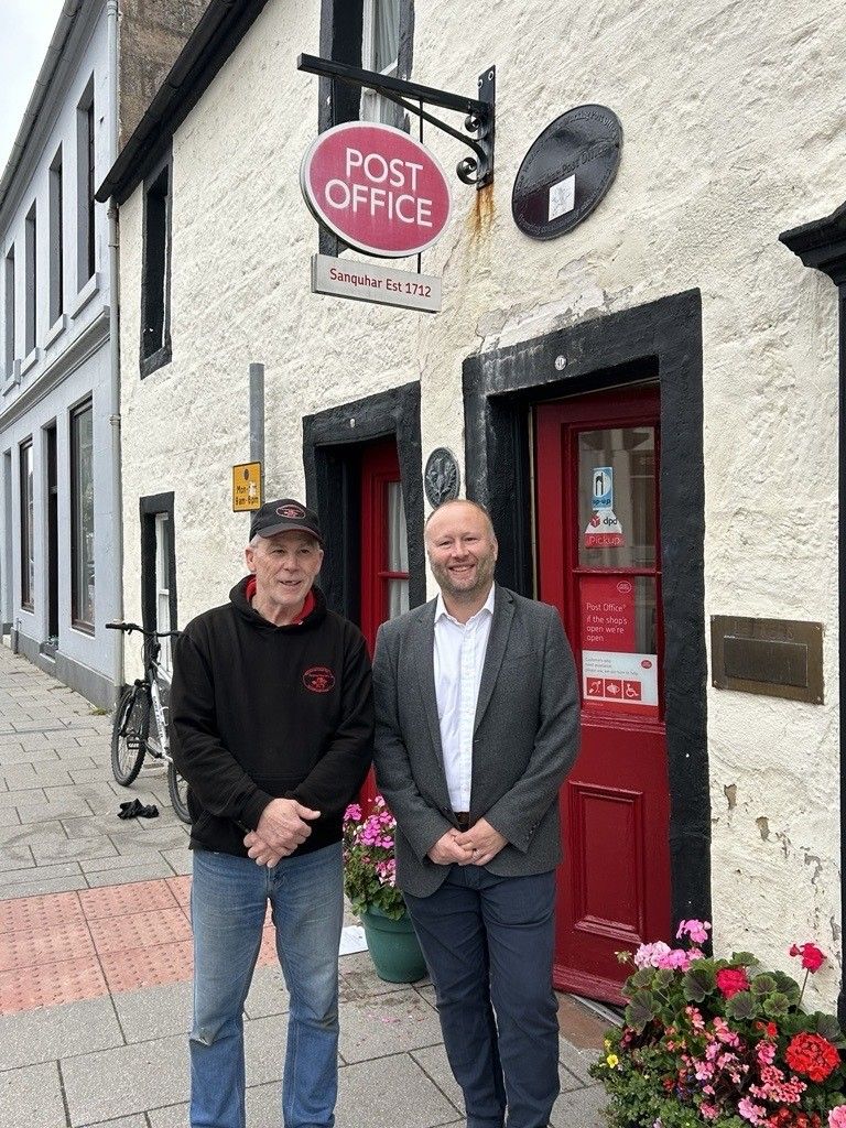 Neil Brocklehurst, Post Office CEO, with Barry Ford, postmaster at Sanquhar post office