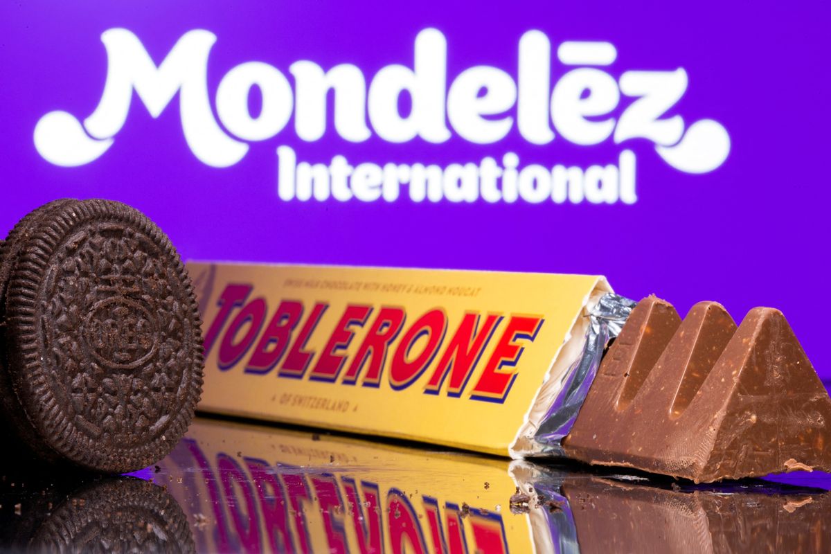 Oreo biscuits and a Toblerone Swiss milk chocolate are seen displayed in front of Mondelez International logo