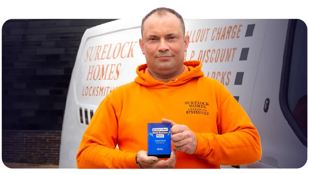 Owner of 'Surelock Homes' receiving the 2024 Britain's Best Small Business Name award