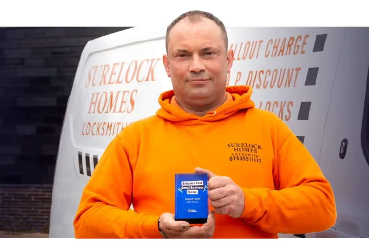 Owner of 'Surelock Homes' receiving the 2024 Britain's Best Small Business Name award