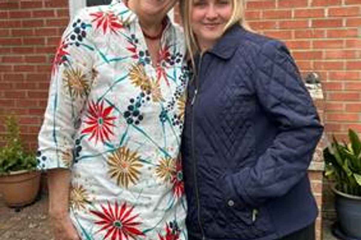 Pauline Crosby, the first-ever 'Nan from Del Monte,' smiling and holding her award, celebrating Britain's baking traditions