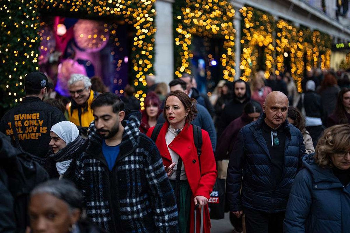 People pass along Oxford Street