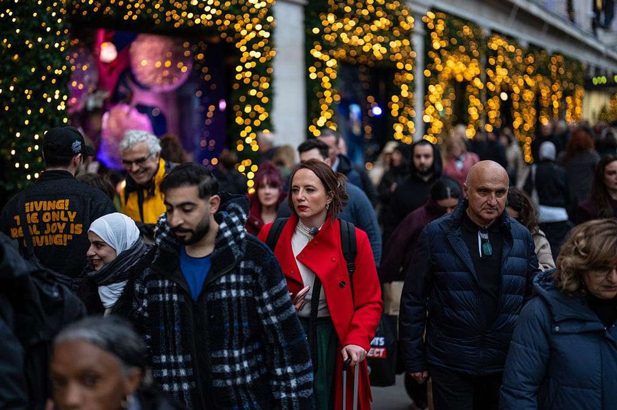 People pass along Oxford Street