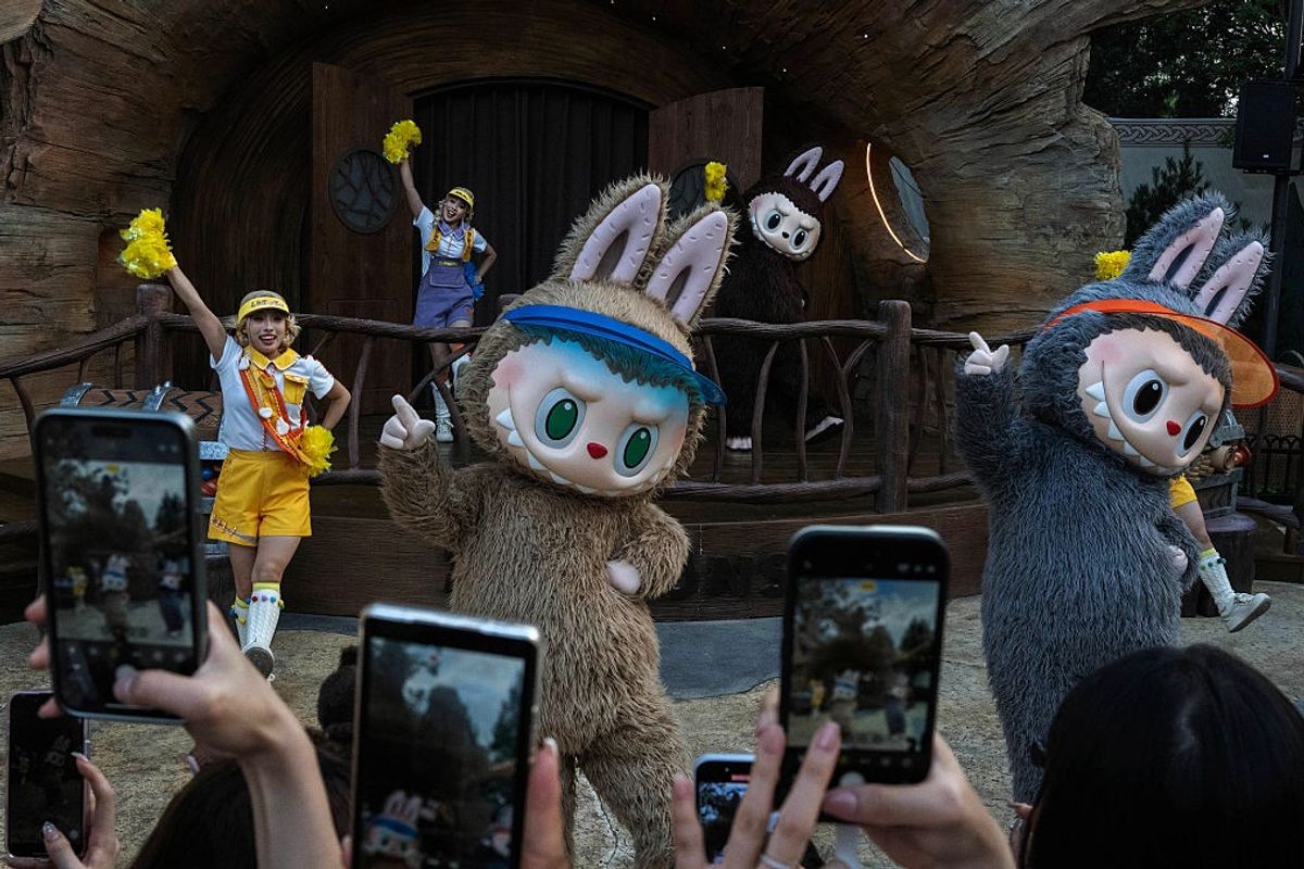 Performers wear costumes of characters from Pop Mart's hugely popular Labubu dolls series