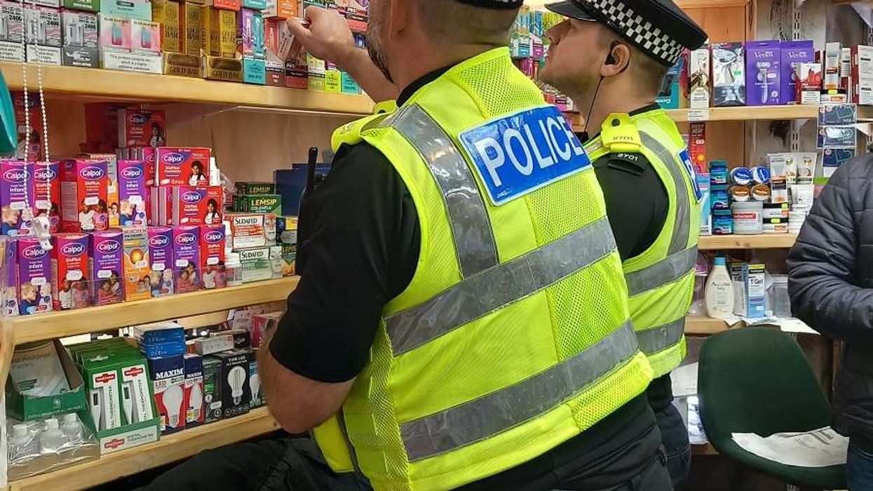 Police officers during a raid as part of Operation Machinize 2