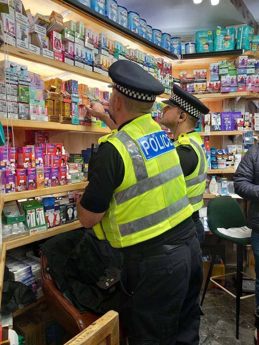 Police officers during a raid as part of Operation Machinize 2