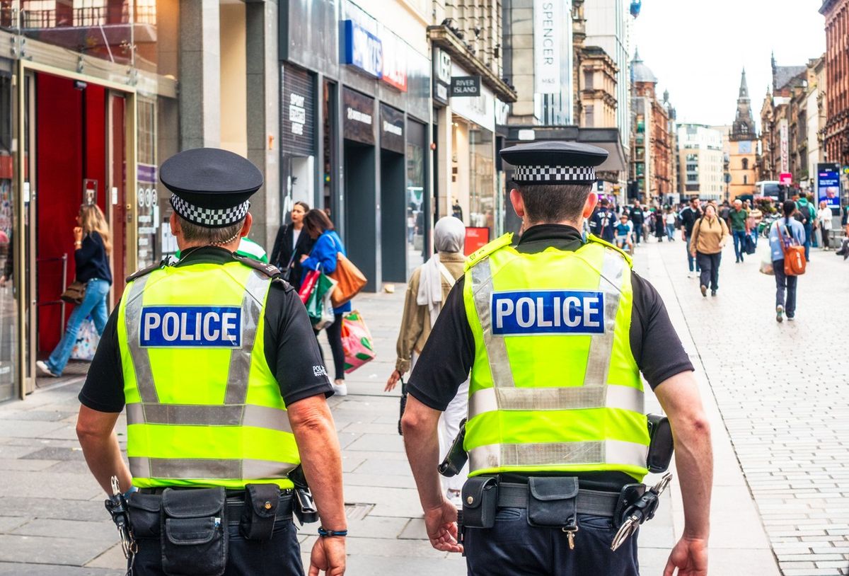  police officers walk on Argyll street in Glasgow's city centre
