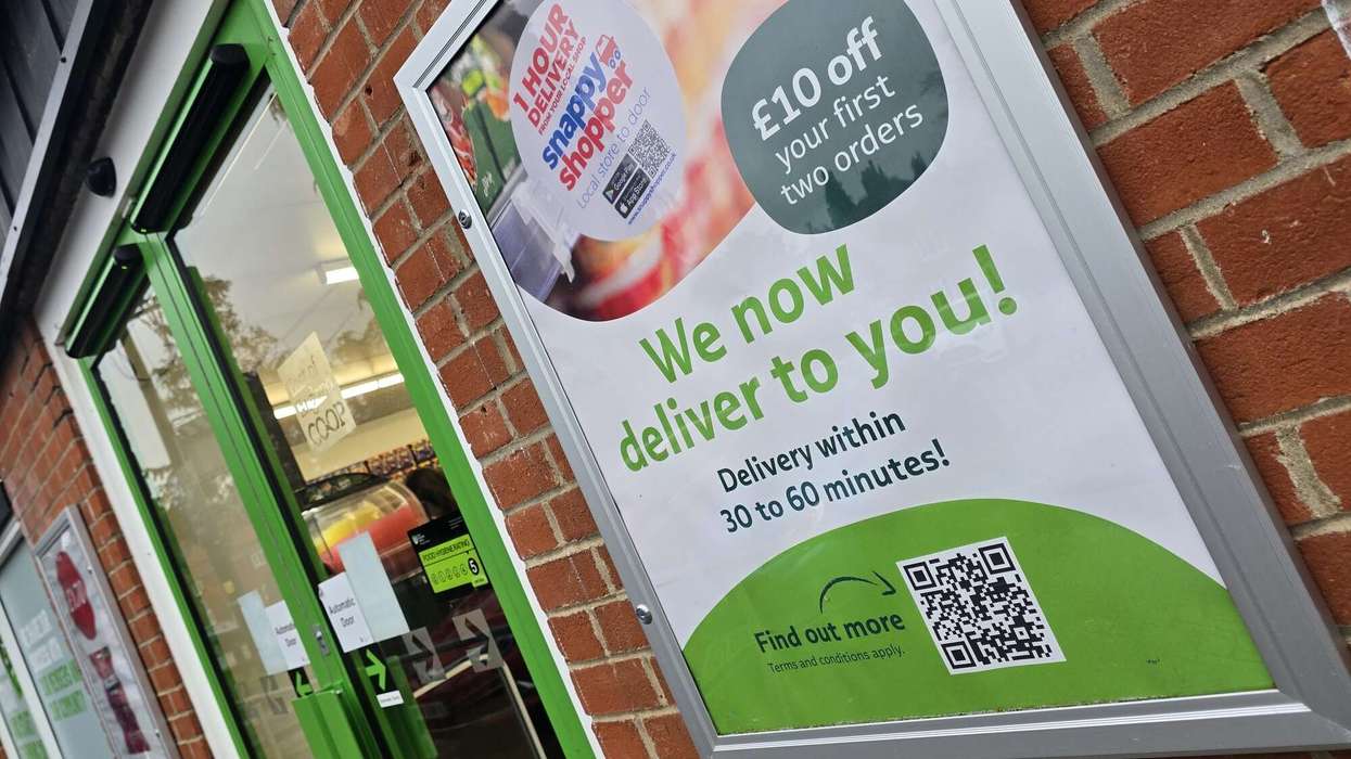 Poster of Snappy Shopper service in front of an East of England Co-op store