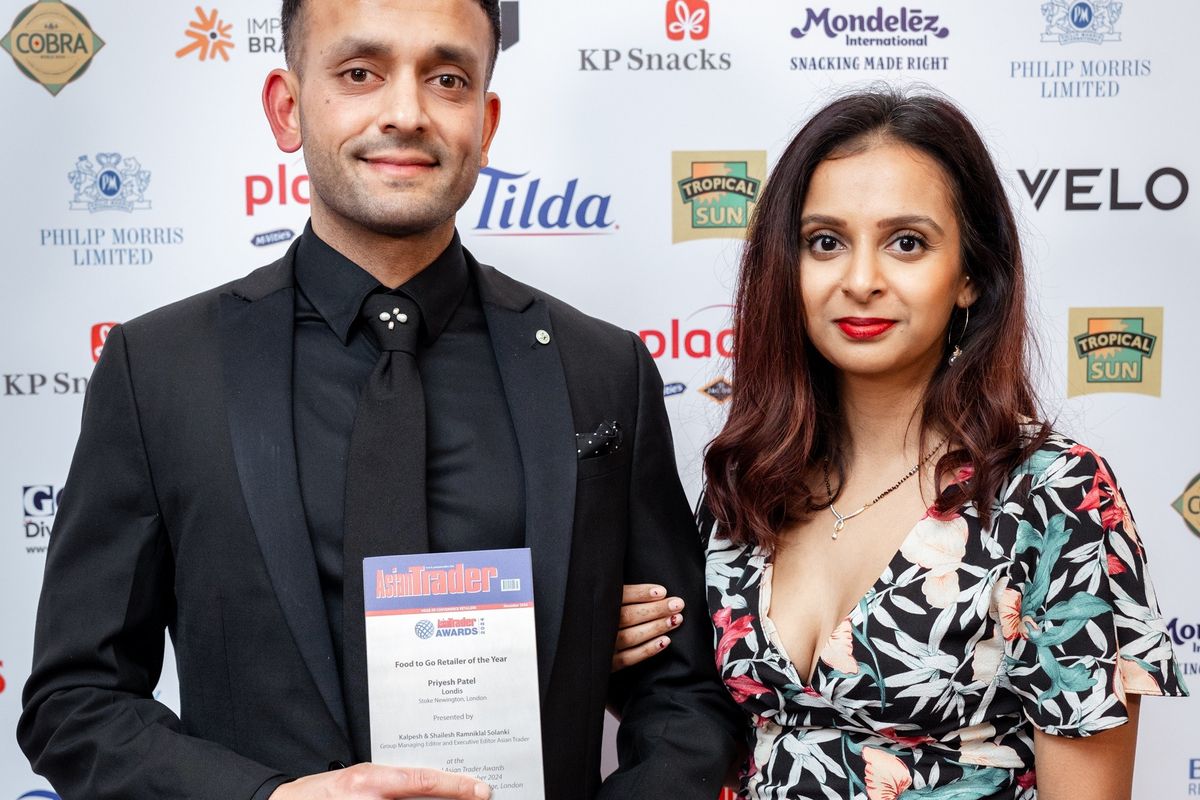 Priyesh Patel with Food to Go Retailer of the Year award for Londis N16 at Asian Trader Awards 2024