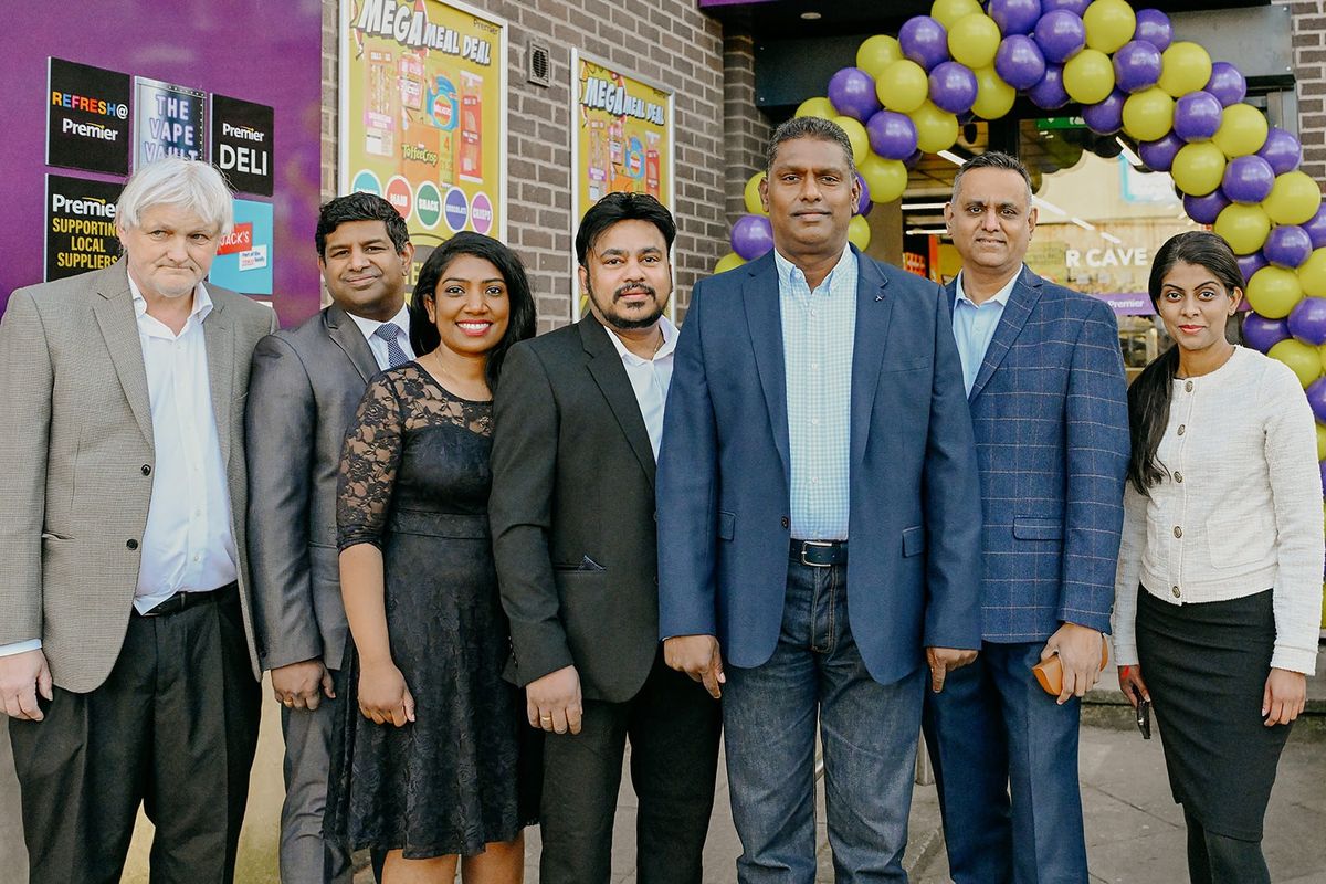 Retailer Jeyaseelan Thambirajah with team at Premier Queen Street launch