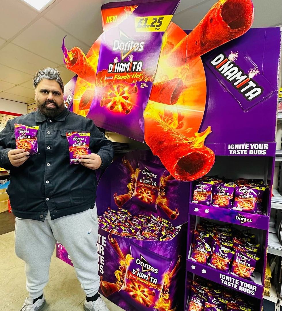 Retailer showcasing Doritos Dinamita in-store activation with vibrant purple and fiery POS display at BB Nevison Superstore