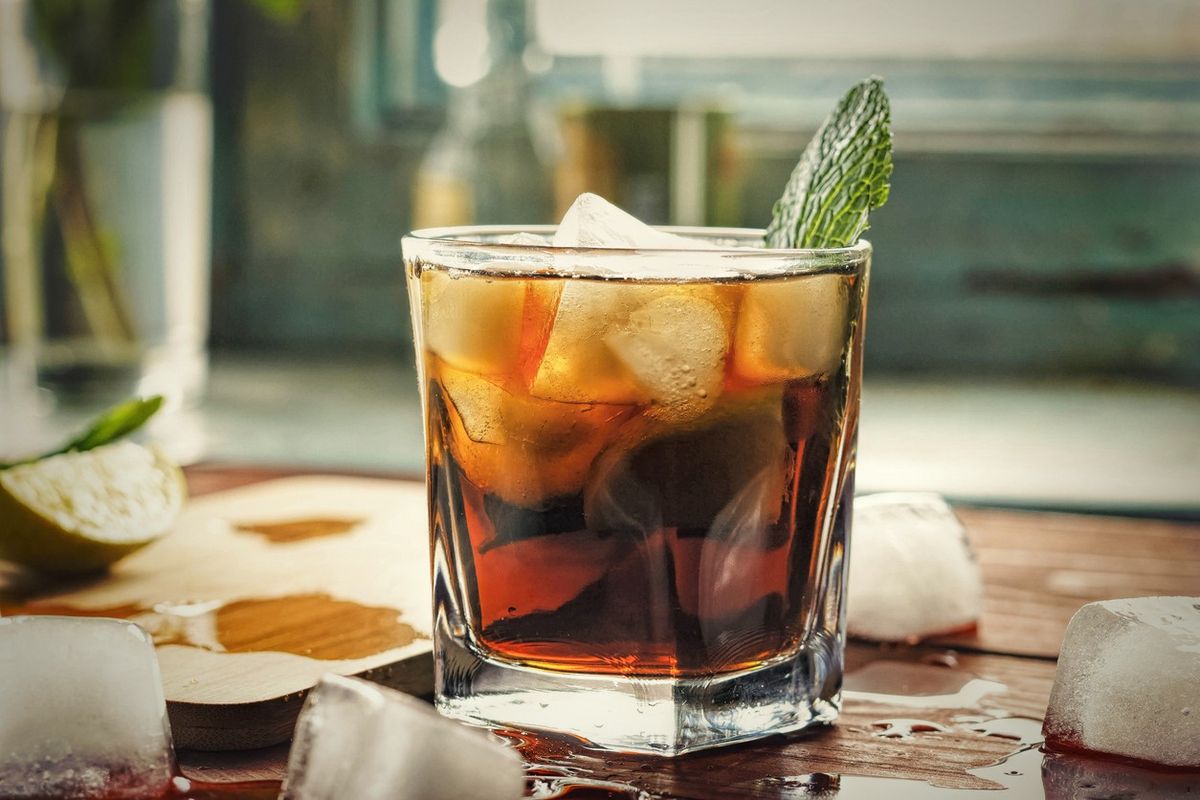 Rum and Coke drink with mint during the rum boom in 2025