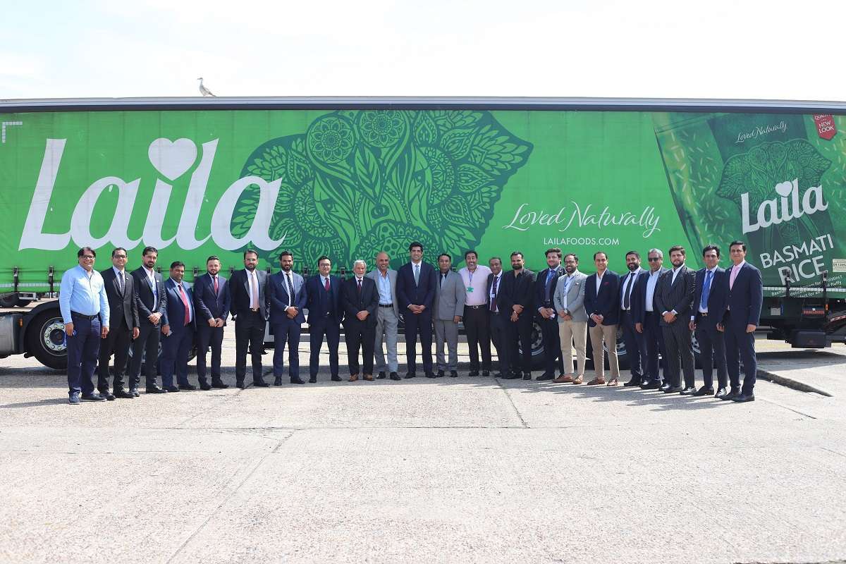 Senior leaders from REAP delegation with Kewal & Harry Dulai in front of Laila branded truck