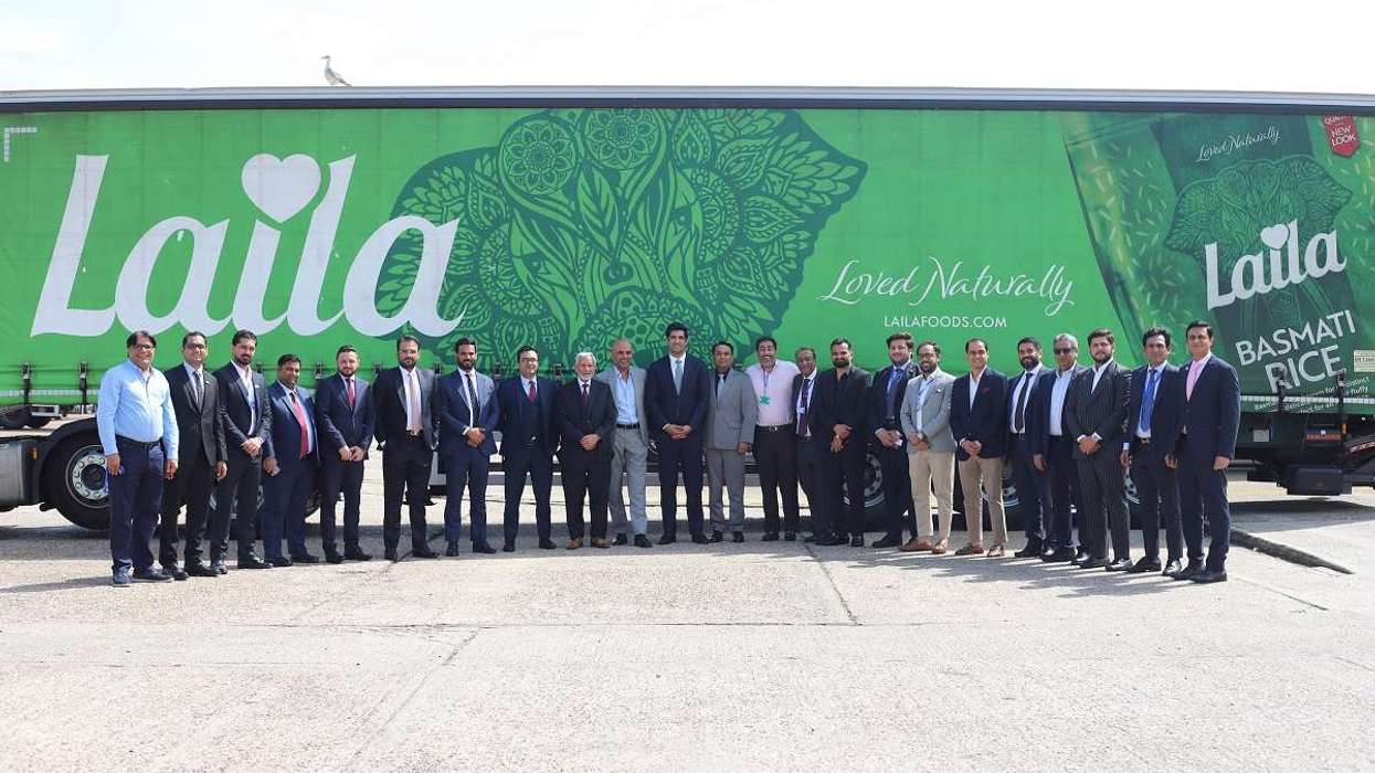 Senior leaders from REAP delegation with Kewal & Harry Dulai in front of Laila branded truck