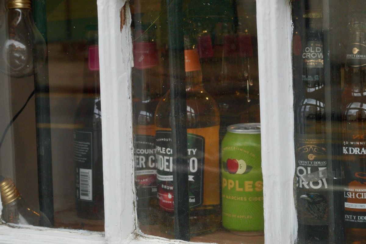 Shop window in Crickhowell high street selling a range of locally produced alcoholic drinks