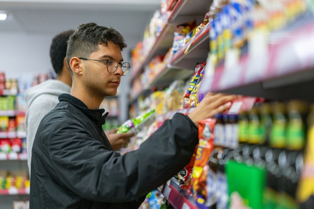 Shoppers browsing snacks in UK store