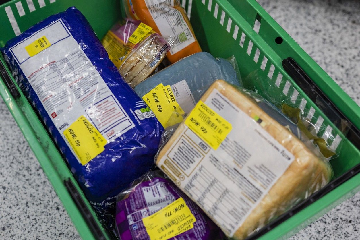 shopping basket with multiple products with yellow reduced stickers on them