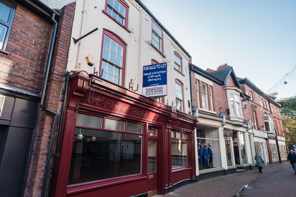 Shuttered UK high street with growing vape shops and closed banks, illustrating retail decline in northern and deprived communities.