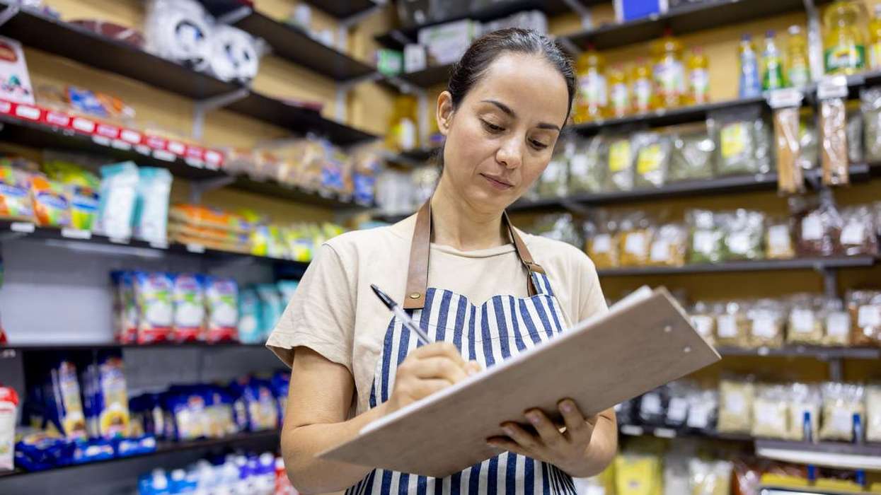 Small business owner working at a local food shop