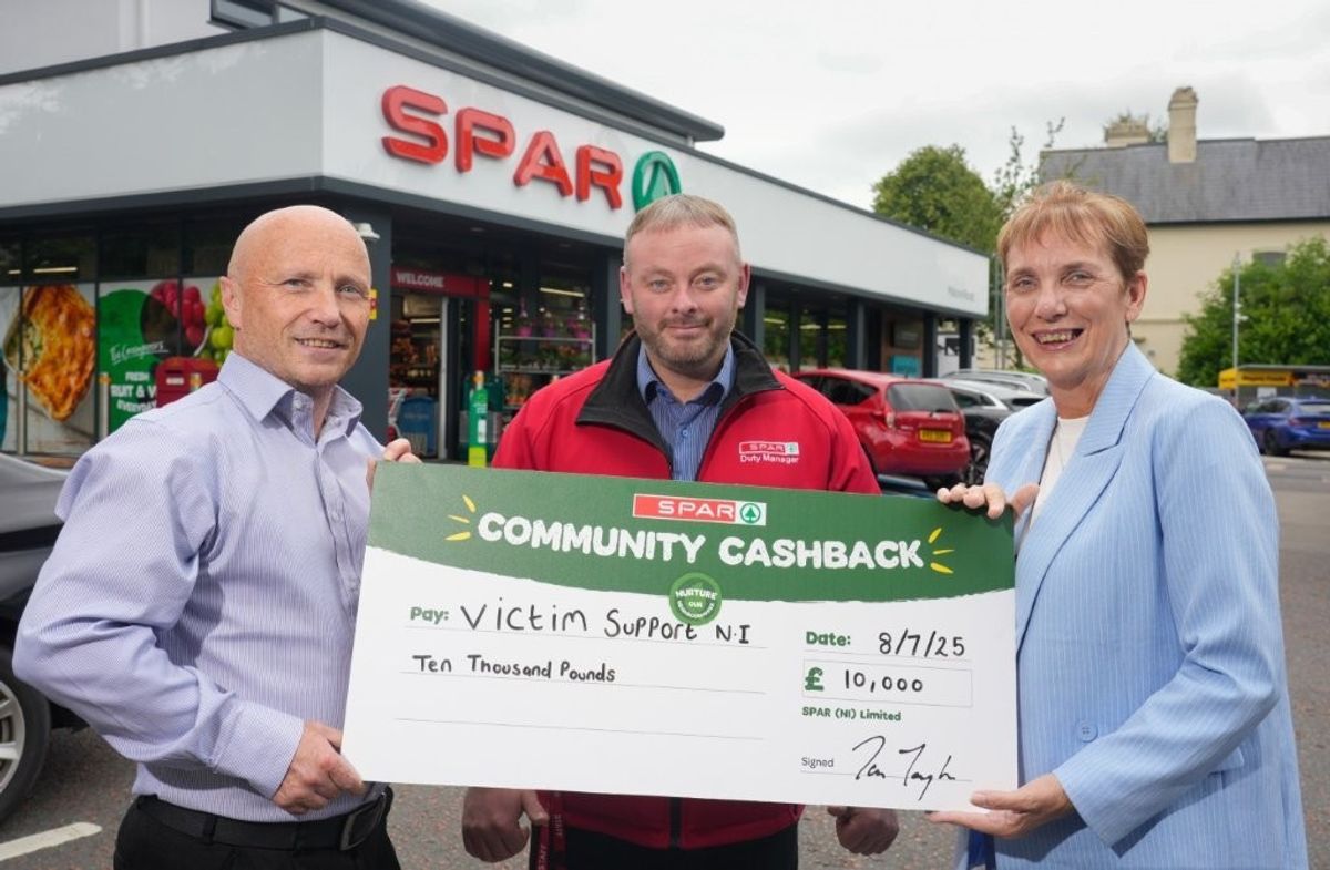 SPAR hands a cheque of £10,000 to ​the charity Victim Support NI 