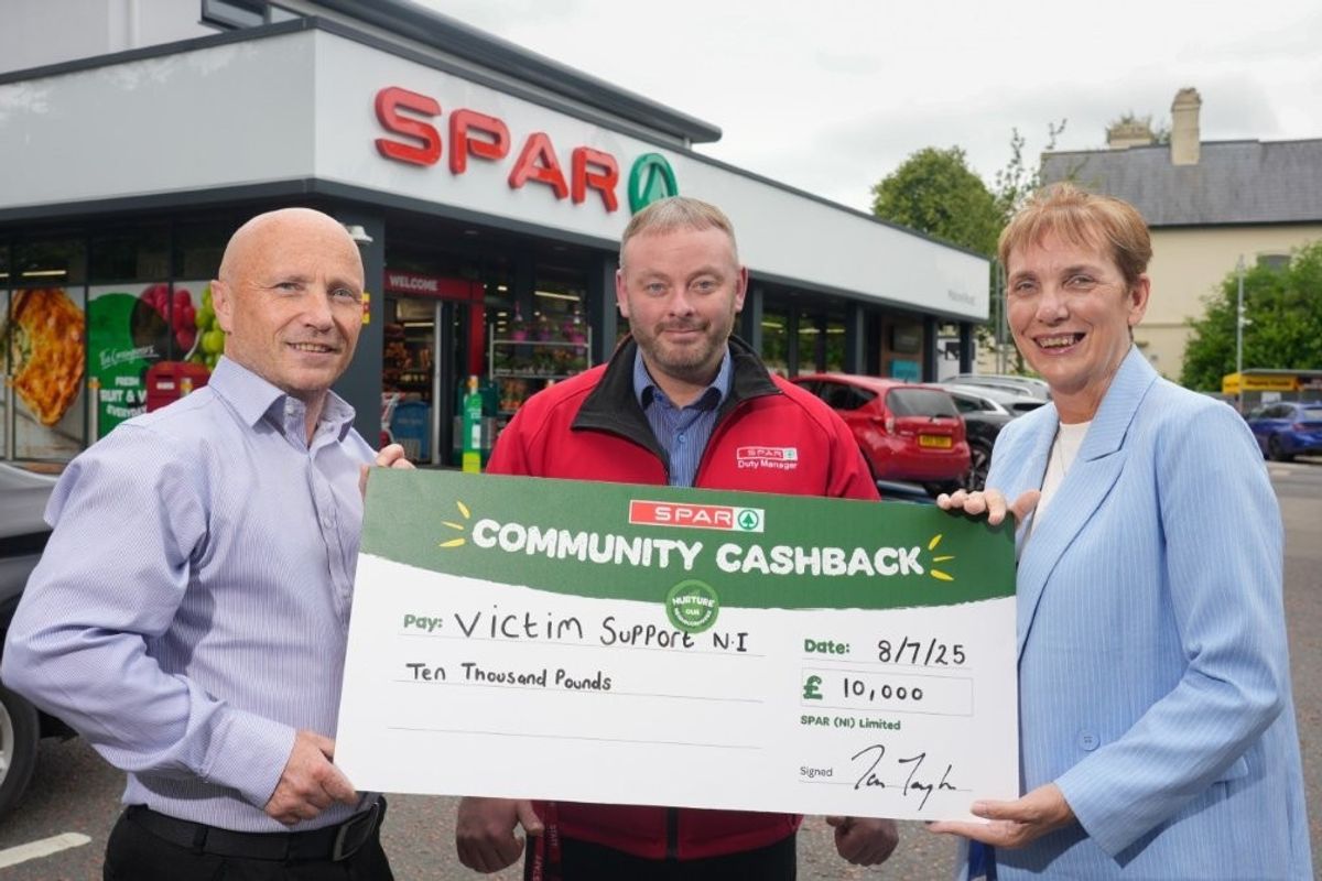 SPAR hands a cheque of £10,000 to the charity Victim Support NI