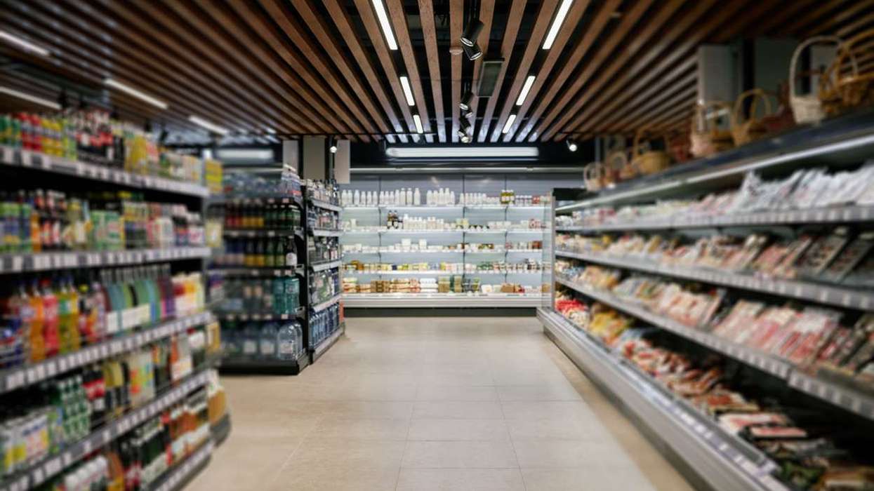 Supermarket aisle with various products displayed on shelves
