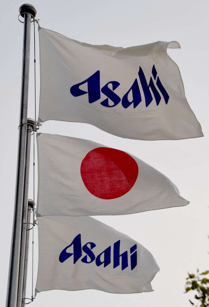The Asahi flags fly with the Japanese national flag