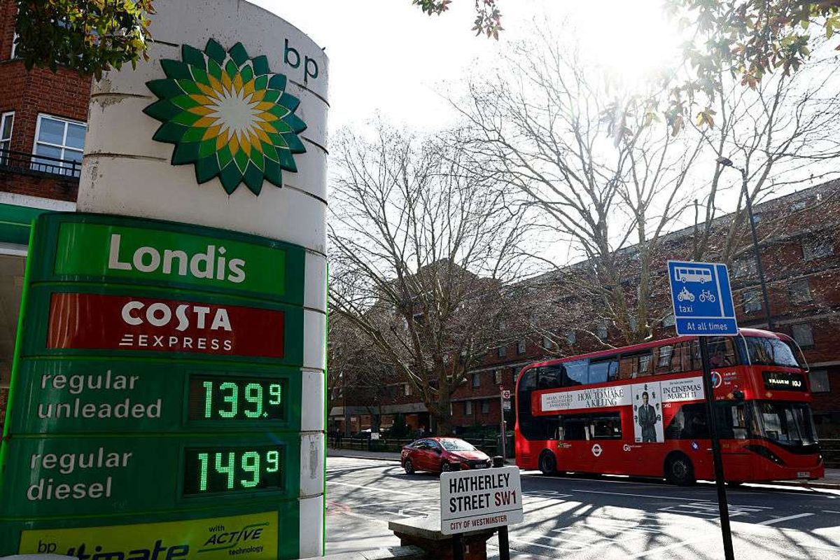 The price per litre of unleaded petrol and diesel fuels are pictured outside a BP petrol station in London