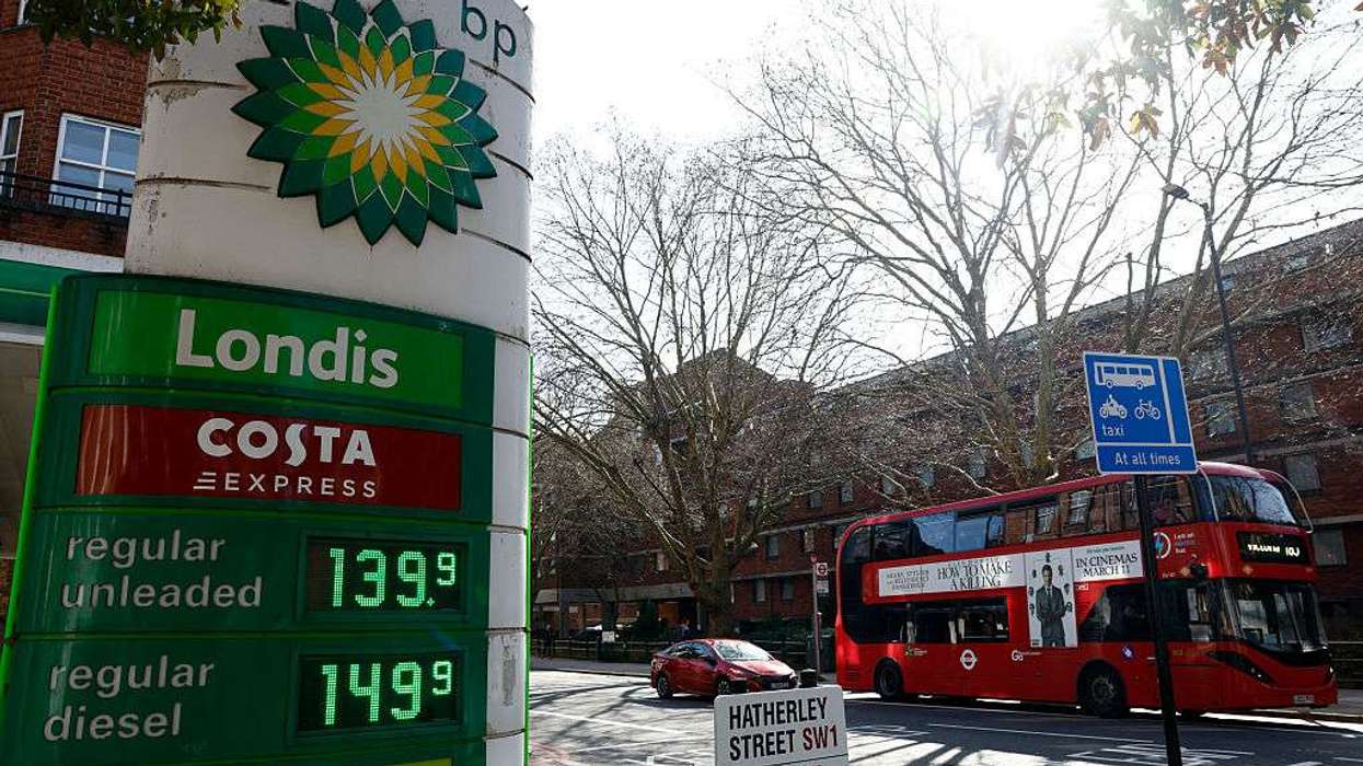 The price per litre of unleaded petrol and diesel fuels are pictured outside a BP petrol station in London