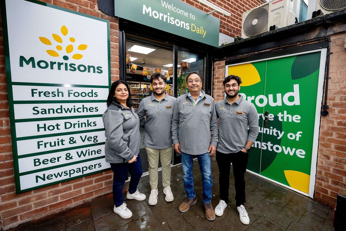 The Sood family in front of their store on Church Street, Edwinstowe