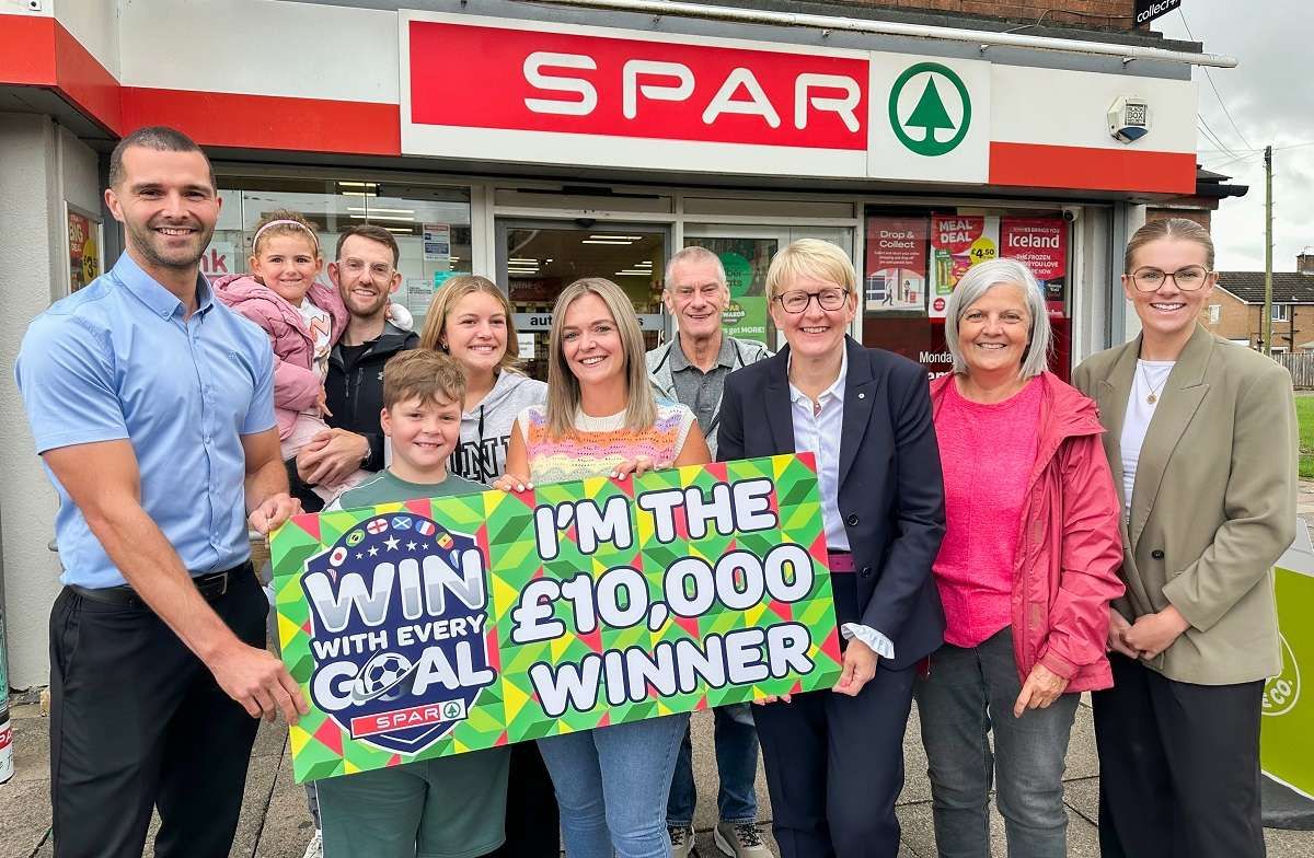 Tracey Pagin received her £10,000 prize with family members outside SPAR Hutton Way in Carlisle 