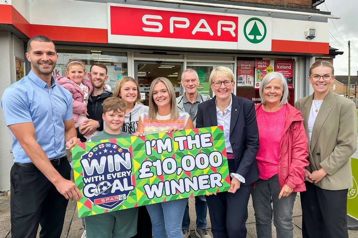 Tracey Pagin received her £10,000 prize with family members outside SPAR Hutton Way in Carlisle