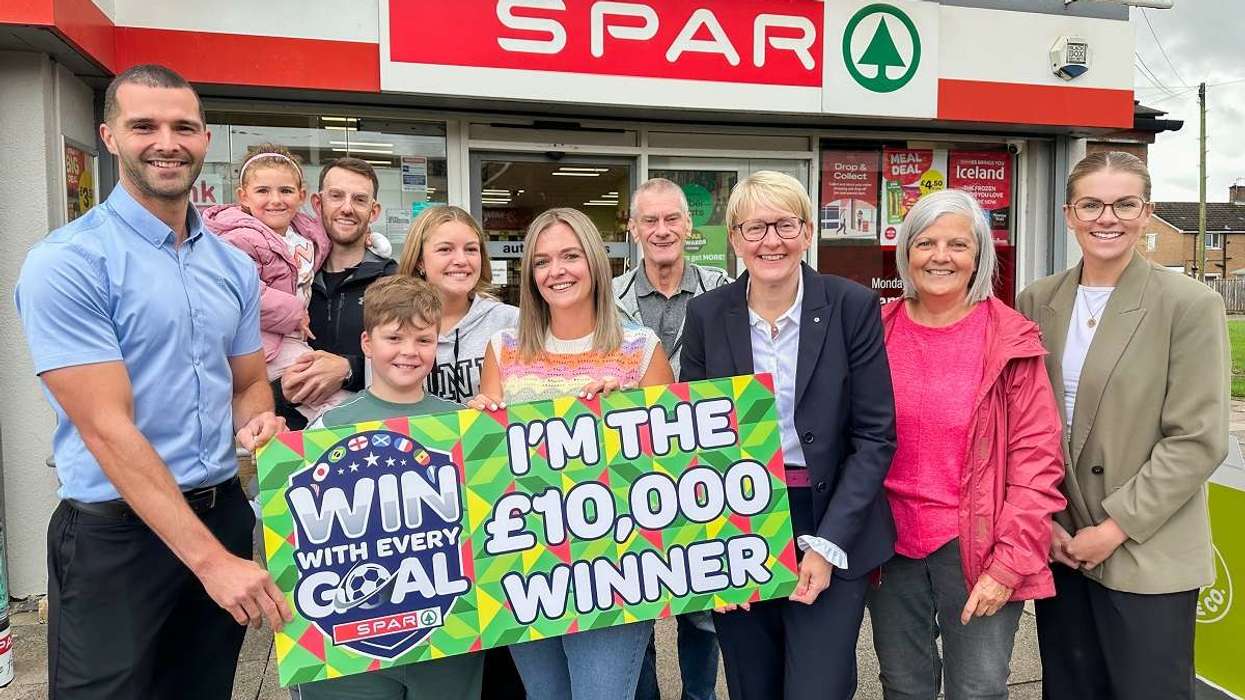 Tracey Pagin received her £10,000 prize with family members outside SPAR Hutton Way in Carlisle