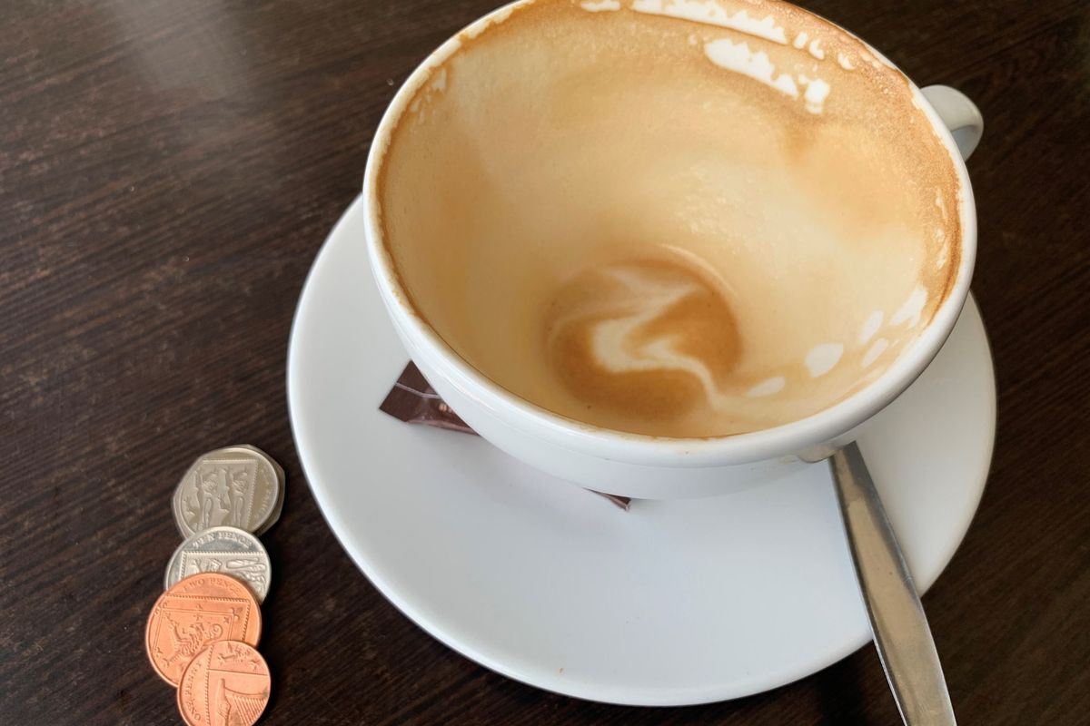 UK coffee shop counter post-latte levy pause, promoting sustainability